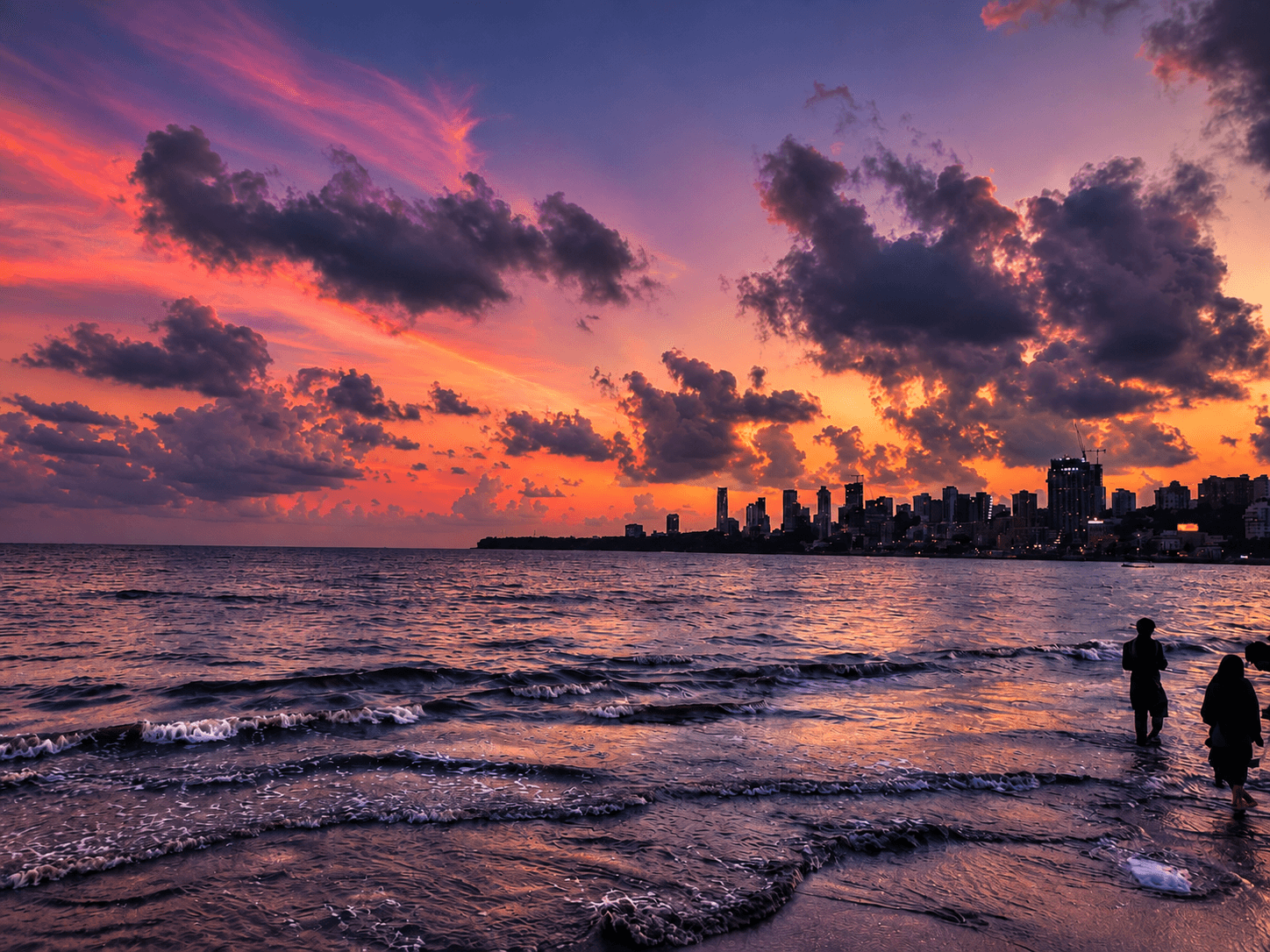 Purple and coral sunset above the waterfront